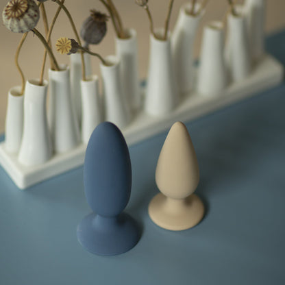 Pine buttplug i beige med stålkugler i